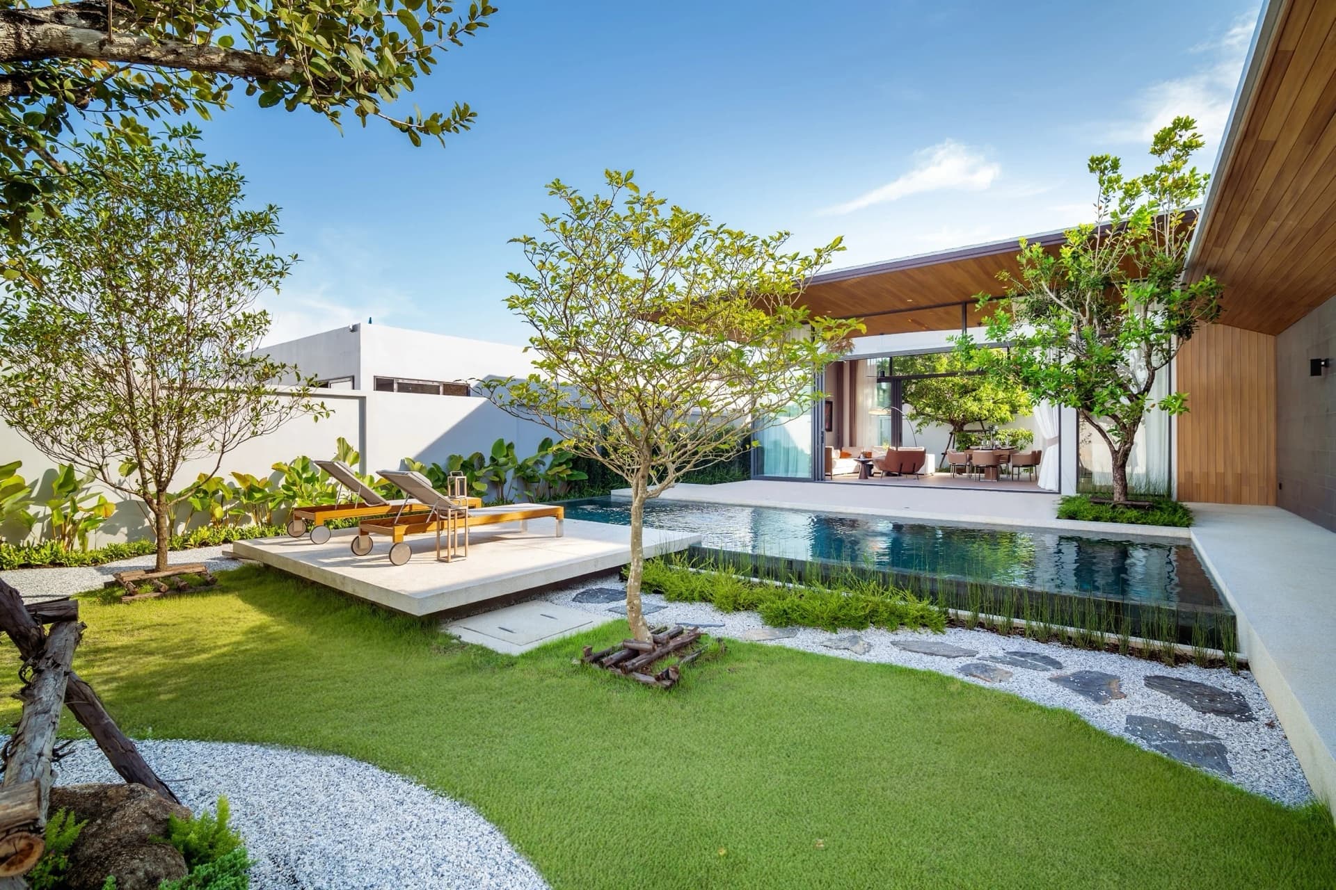 Botanica Four Seasons — villa exterior with lush tropical landscaping
