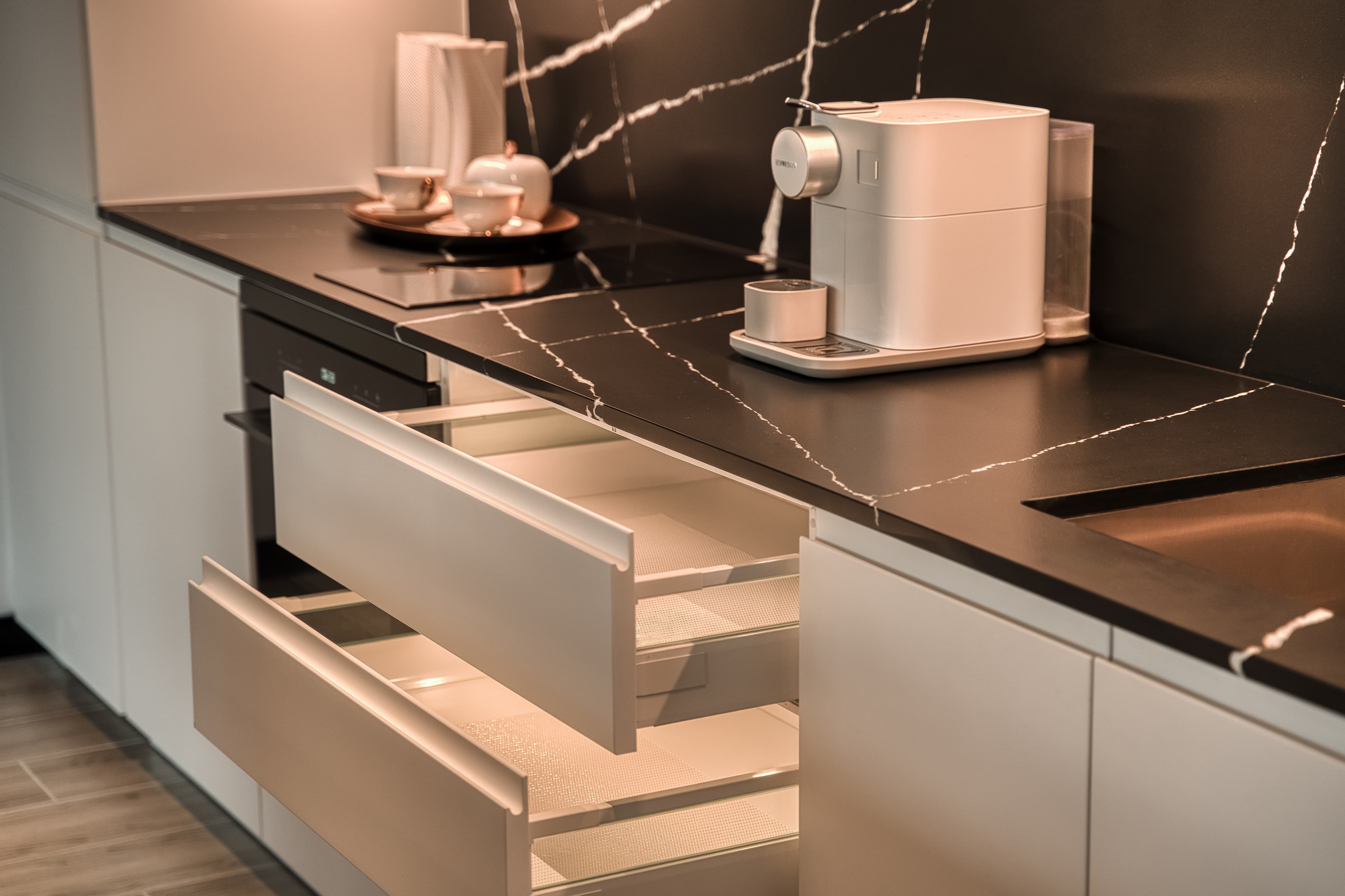 Essence Residences kitchen — modern fixtures, premium finishes