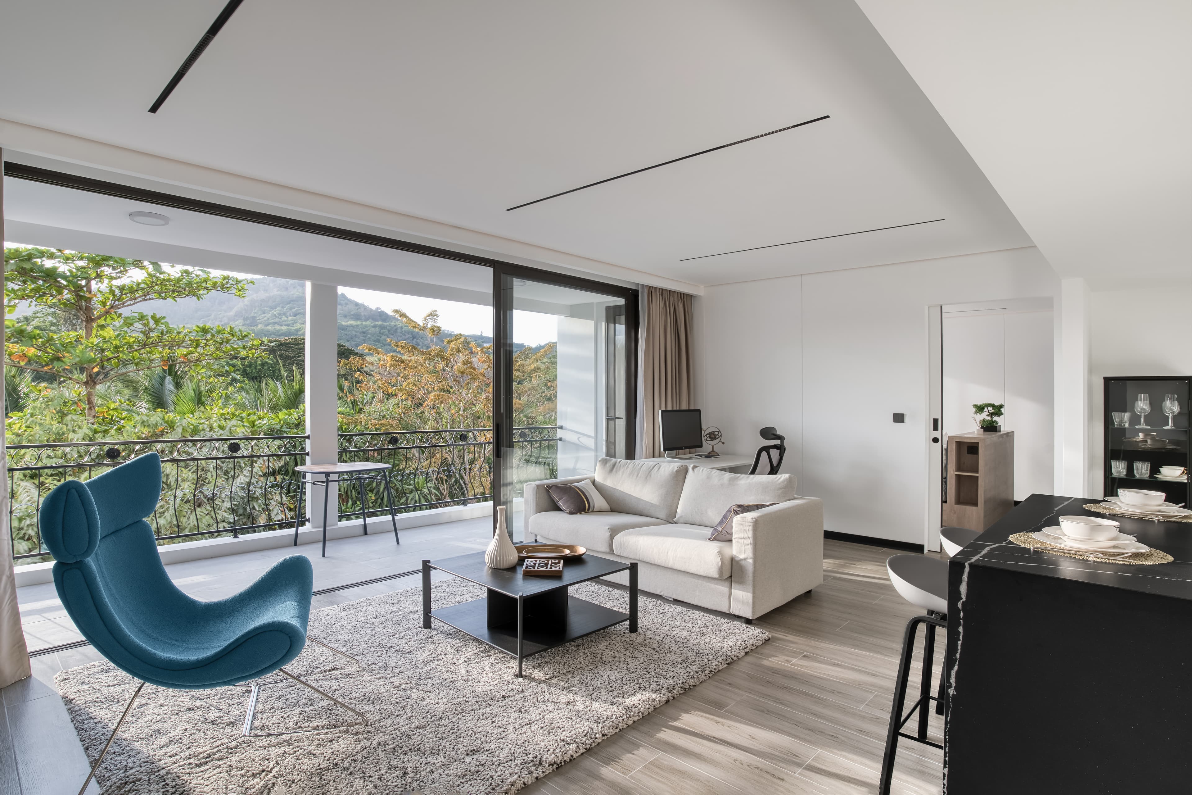 Essence Residences living room — contemporary tropical interior